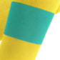 Close-up of a yellow sock with a teal band on a white background (Green)