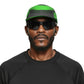 Man wearing a green and black cap and sunglasses on a white background (Green)