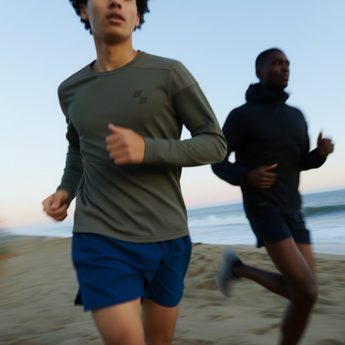 Two people running on a beach with a clear sky (Black)