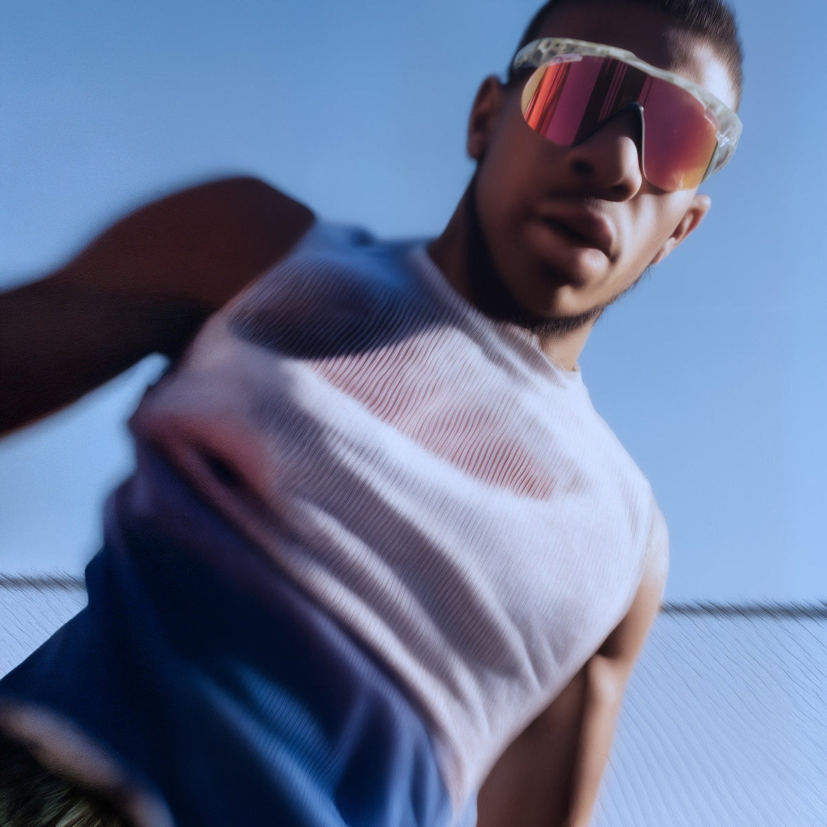 Person wearing a white tank top and pink sunglasses against a blue sky (Pink)