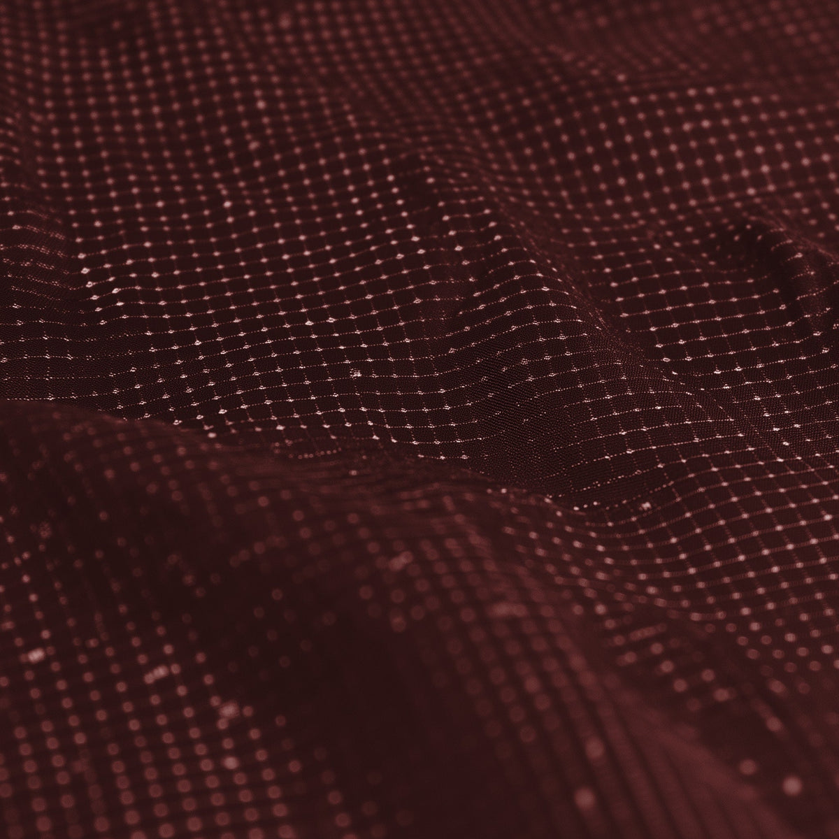Close-up of a textured brown fabric surface (Red)