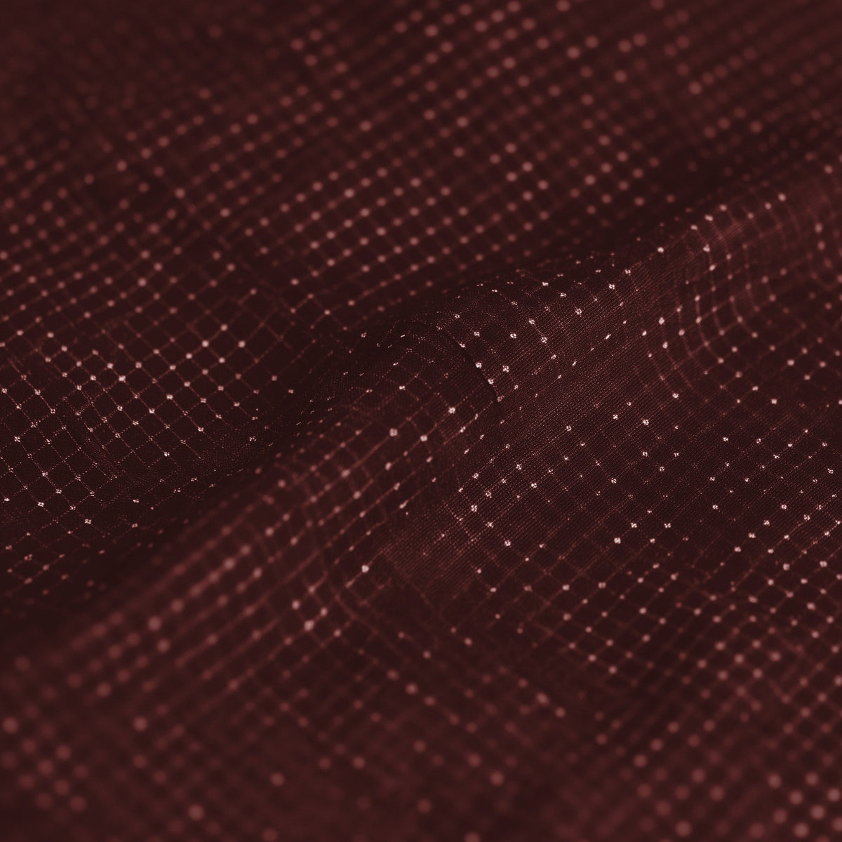 Close-up of a textured brown fabric surface (Red)