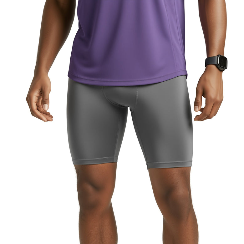 Person wearing gray athletic shorts and a purple top on a white background (Gray)