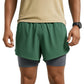 Green athletic shorts worn by a person on a white background (Green)