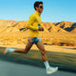 Person running in a desert landscape with mountains in the background (Yellow)